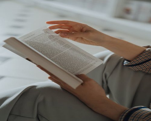 Person relaxing reading a book without background noise