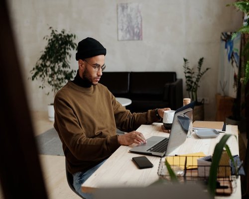 Person working from home in a calm environment without headphones